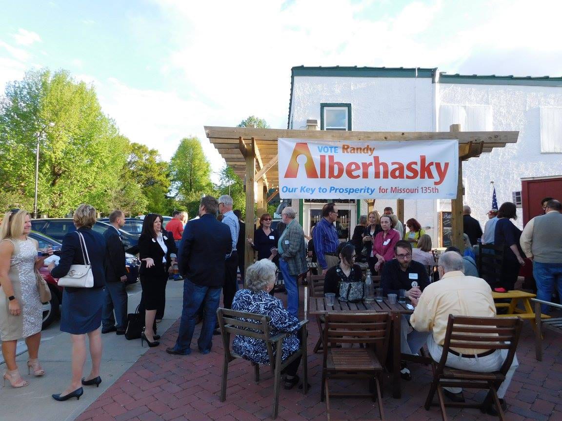 Vote Randy Alberhasky event on outdoor brick patio with large crowd