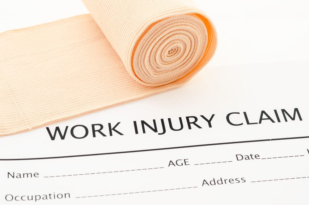 Close up of Work Injury Claim form and bandage roll